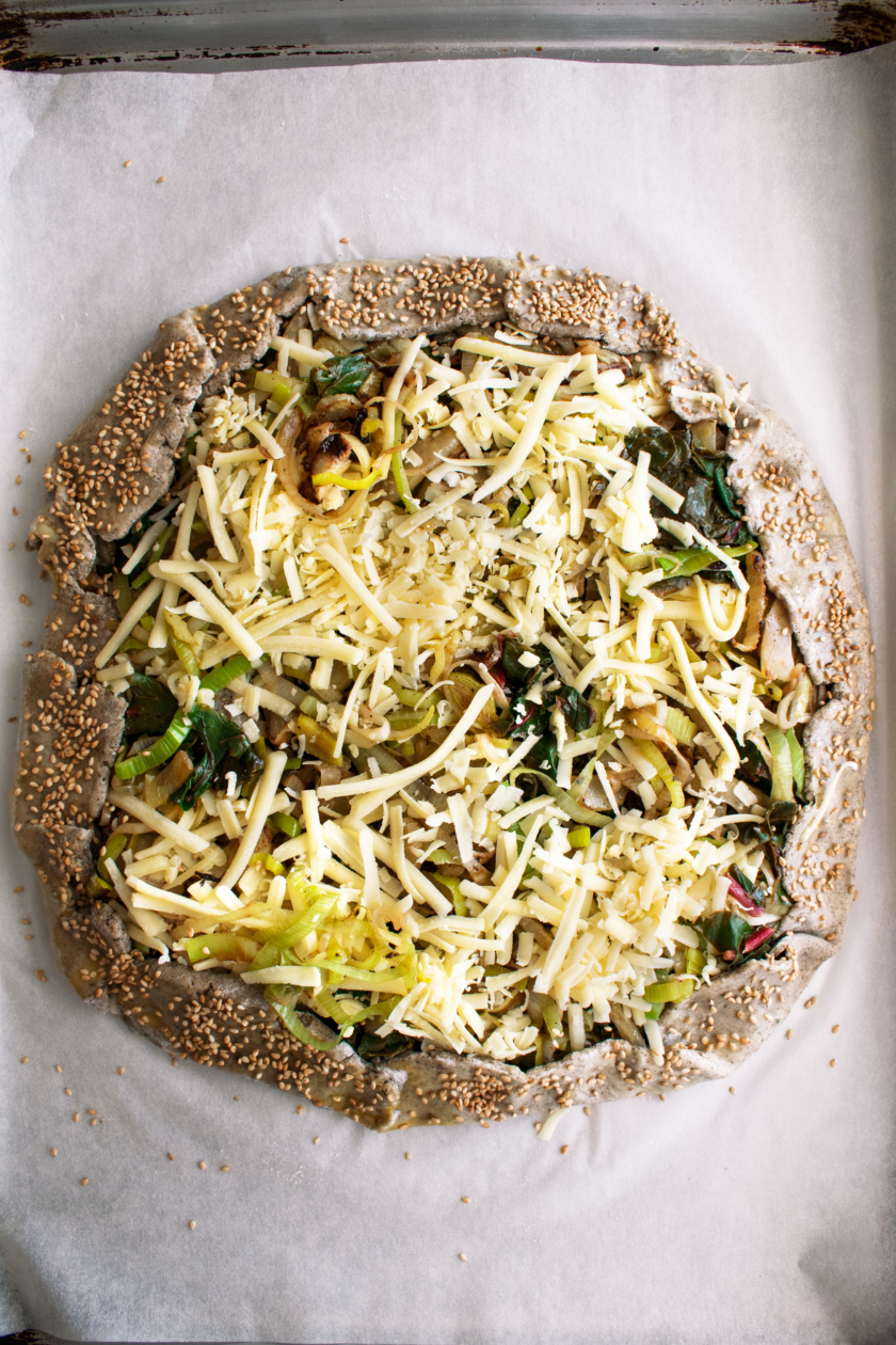 crostata on a sheet pan before it goes into the oven