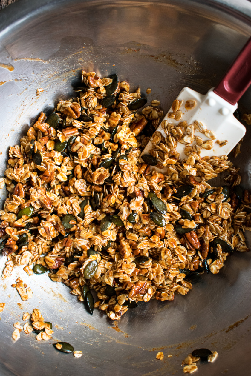 granola ingredients mixed in a bowl